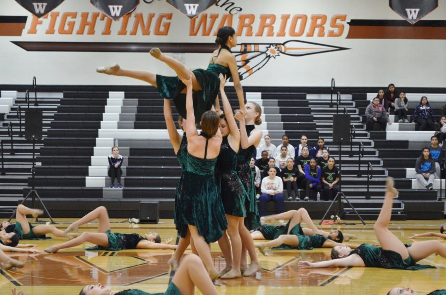 Susi Chavez 19 is lifted high into the air during the SunDancers lyrical routine. 