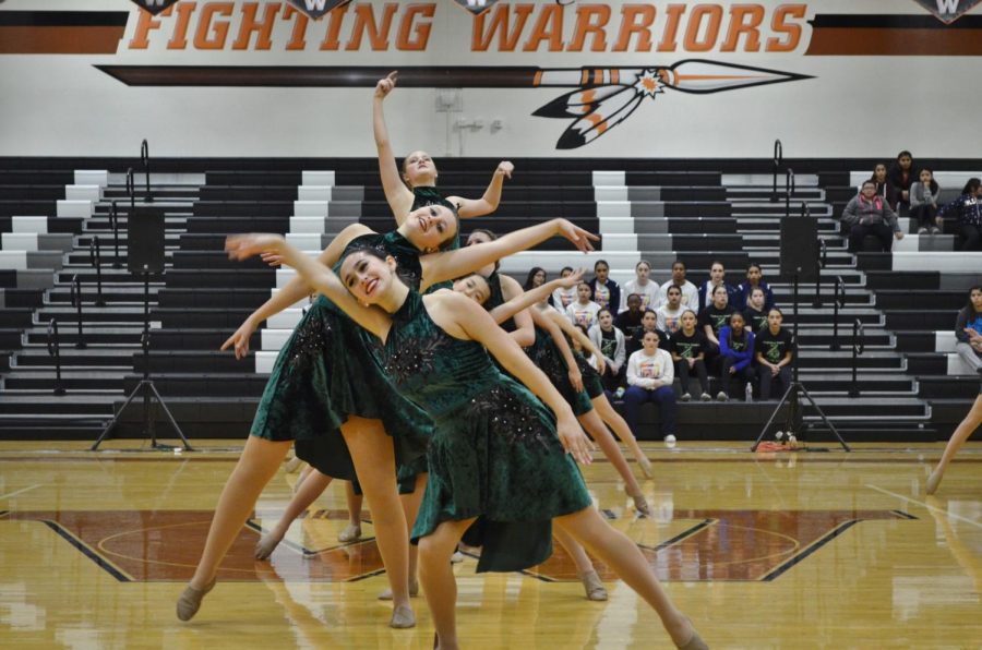 The SunDancers sway in opposite directions while Brooke Weatherbie 20 is lifted upwards.