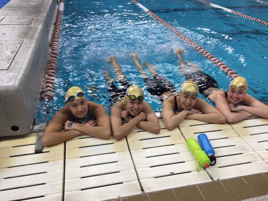 The girls 200-yard medley relay team relaxes in the UT warm-up pool.
Photo Courtesy of Matt McBrearty