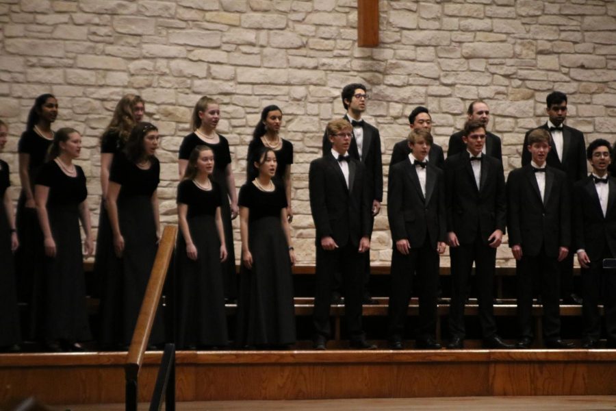 Chamber choir warms up before the concert.