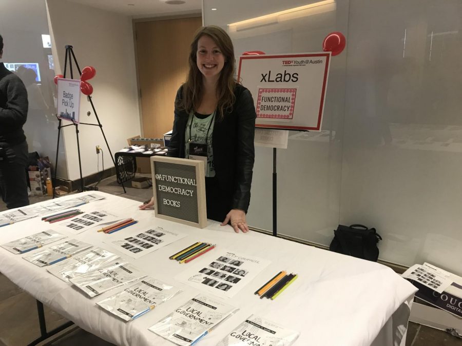 Amy Stansbury, an author at Austin EcoNetwork, sets up a stand to teach students about the local government. 