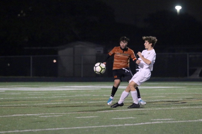 Lalo Rodriguez 19 watches the ball before stealing it from a McNeil player.