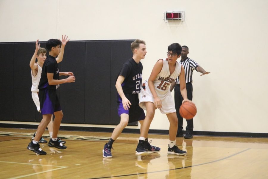Eshaan Guila 22 attempts to keep the ball away from Cedar Ridge players. 