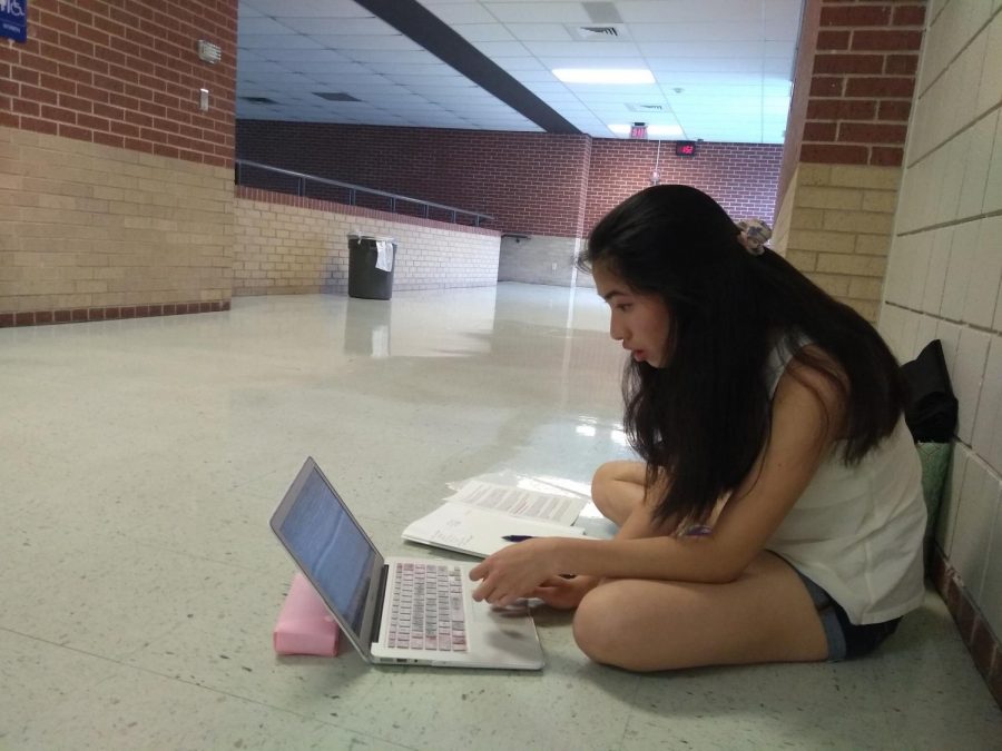 Grace Chen 20 prepares for her next debate. Photo courtesy of WHS Speech and Debate.