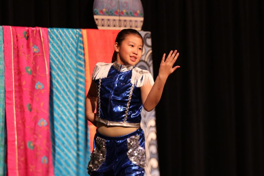 A performer from Laurel Mountain Elementary School dances to a modern Chinese song.