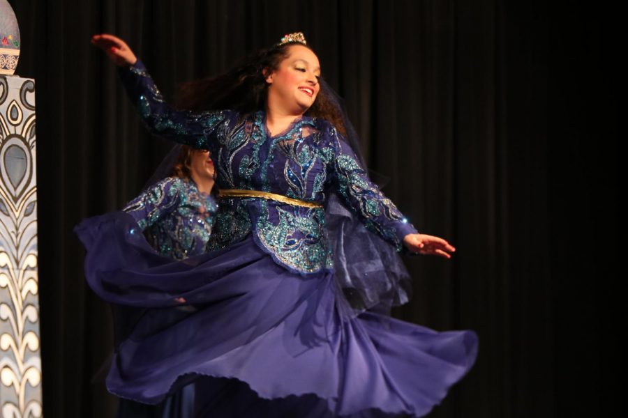 A performer from UT Austin spins in her Persian dance.