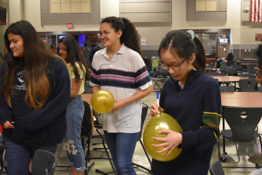 Visual & Performing Arts academy students participate in an activity with balloons.