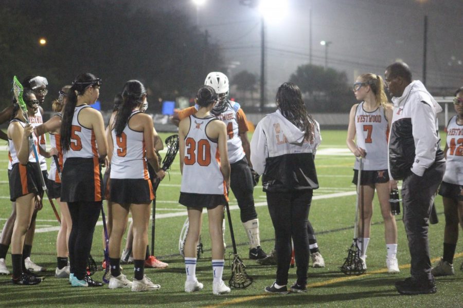 The team strategize their play during the first time out.  