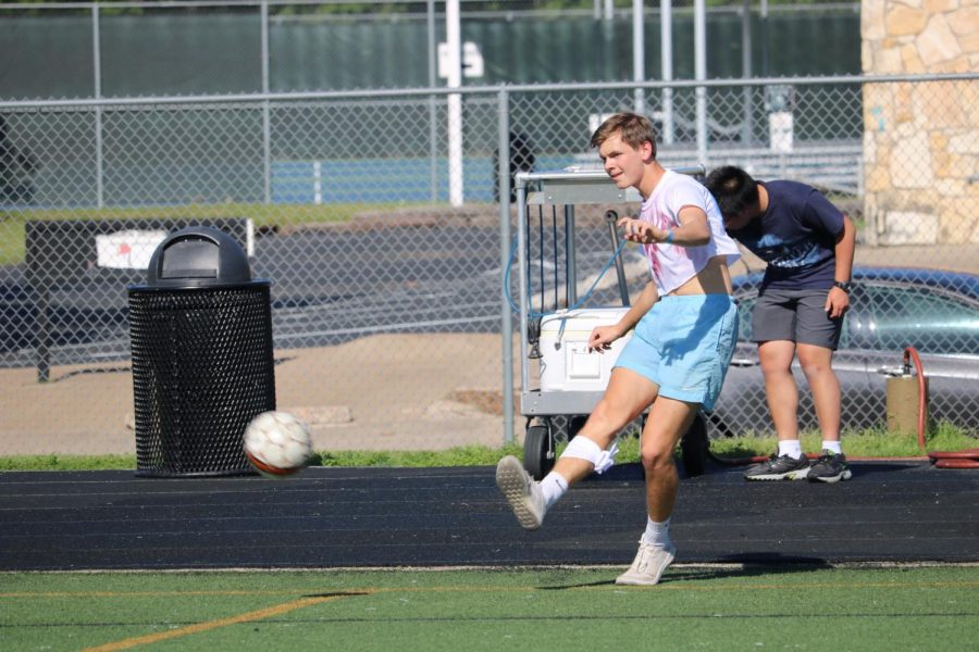 Coby Koch 20 practices before his team competes in the 3 vs. 3 soccer battle. 