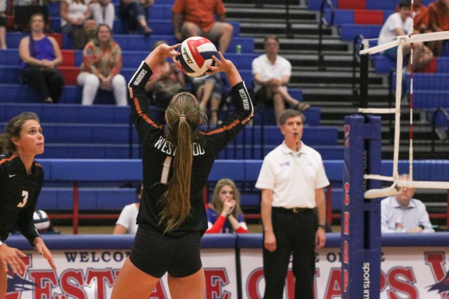 Kenzie Beckham 21 sets the ball. This play ended with Westwood winning the point.