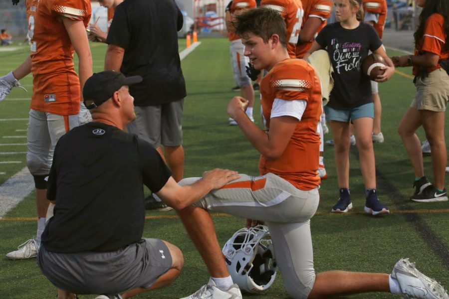 Any time is a good time to motivate your players, Coach Wood takes time during the game to sit down with Mathew Lescano 22 and share some words of encouragement. 