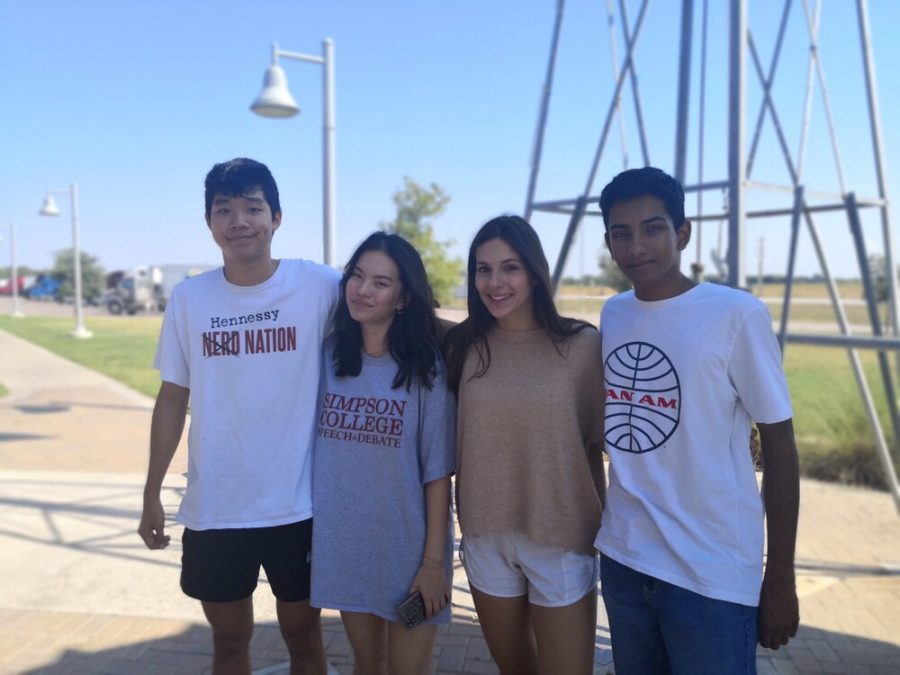 At the Grapevine Classic tournament, Frank Lai 20, Sophia Wang 21, Mika Freund 21, and Harsha Rajesh 20 take a photo together. Photo courtesy of WHS Speech and Debate.
