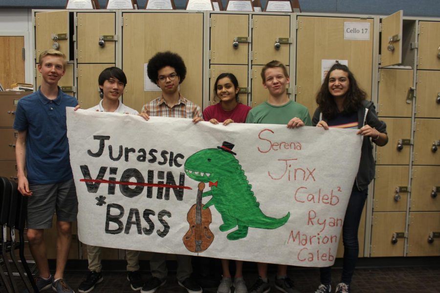 The bassists and fake bassists held up their poster for all to see since it took them an effort to recruit people to help.  Their inspiration came from the fact that in order to explain to others what a bass is they have to say its a giant violin.