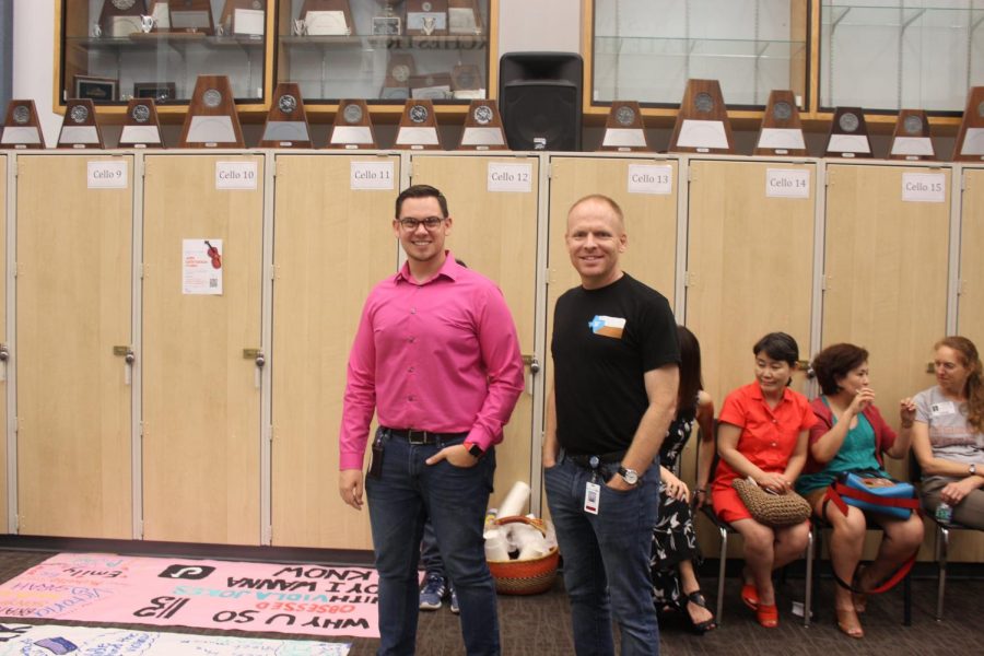 Mr. Thompson and Mr. Anderson marvel at the turnout of the posters all the musicians created.  They see that all the hard work that went into planning the event paid off.