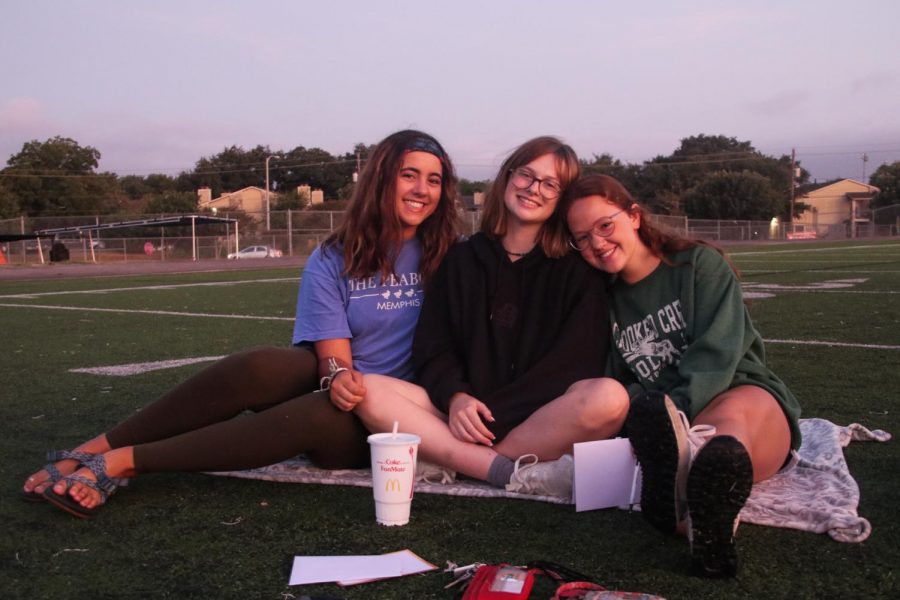 Seniors Presley Turner, Carrie Buckley, and Audrey Lemen enjoy the warm rays of the sun.