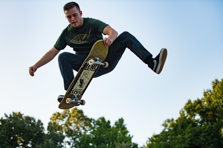 U.S. Air Force Airman 1st Class Nick Whitehurst, 633rd Communications Squadron client systems technician, nose-grabs his skateboard in Smithfield, Va., July 26, 2017. For Whitehurst, skateboarding is not only a work out, but a mental challenge involving perseverance as some tricks take months to perfect. (U.S. Air Force photo by Tech. Sgt. Natasha Stannard)