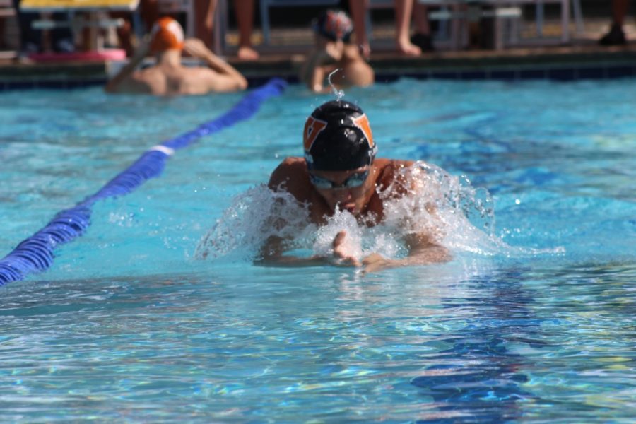 Benji Truong 21 takes a breath in the 100-yard breaststroke. Known for this to be his best event, Truong won his heat. 