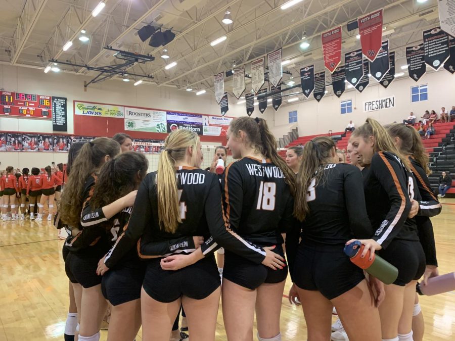 The Lady Warriors huddle up after Vista Ridge called a timeout. Head coach Tara Grant discussed with the athletes about their plays. 