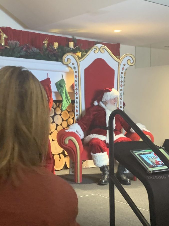 One of the most looked forward to things on the agenda was getting a picture with Santa.  The line wrapped around the whole floor, filled with mostly eager little kids.