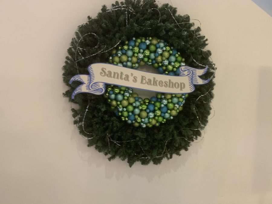 To direct guests to the complimentary dessert bar, there was a sign hung up under the escalator that said Santas Bakeshop.  The kids enjoyed eating the desserts.
