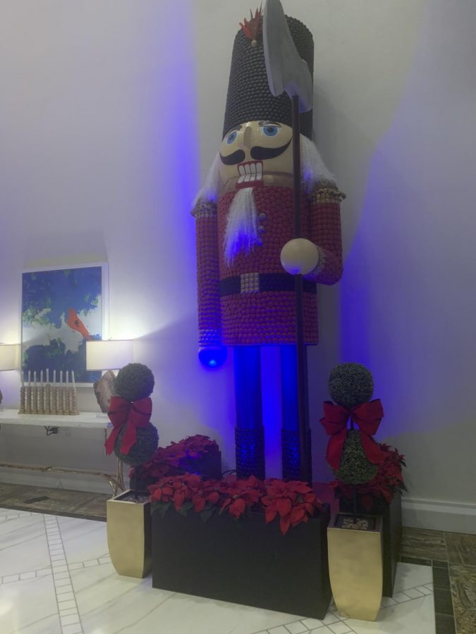To make the hotel lobby seem more festive, a giant nutcracker made of 17000 French macaroons named Captain Candy.  It was made in over 350 hours.