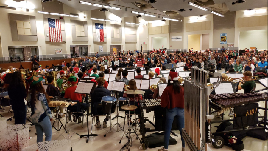 Penelope Higdon 22 conducts Wind Symphony, or second band, as she was able to raise more than a thousand dollars for March-a-Thon, a band fundraiser. Photo courtesy of Ms. Farah Metzger.