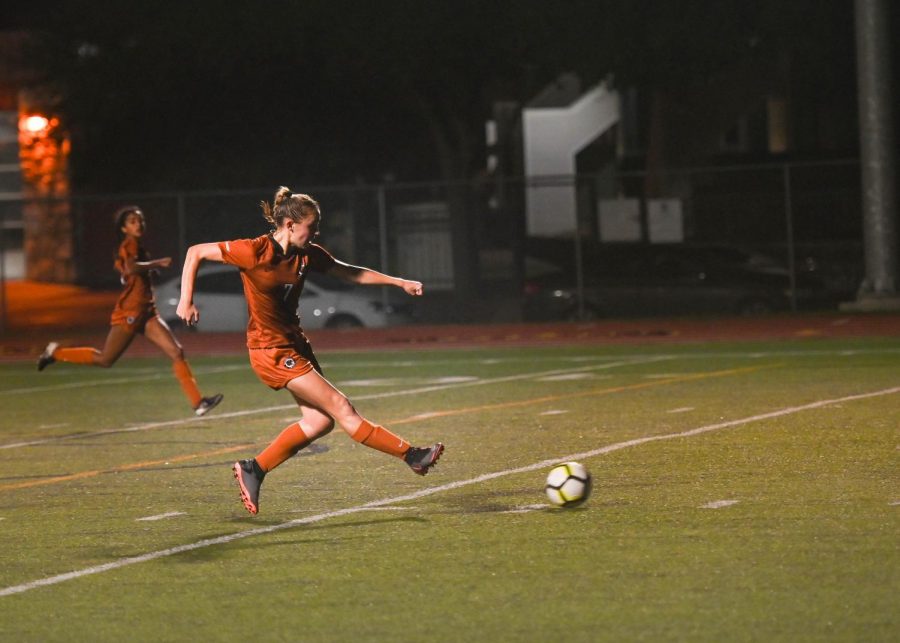 In the air, Skylar Zinnecker 23 kicks the ball to a team mate. Zinnecker was able to dribble the ball down field which allowed the team to score the second goal of the game dominating the game 2-0. 