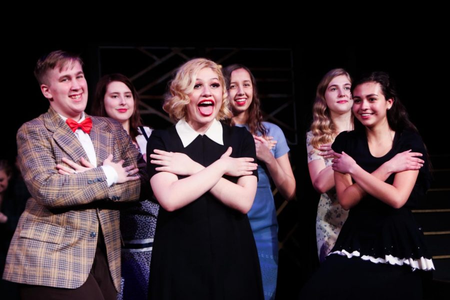 Surrounded by the rest of the cast, Liesel McMahan ‘21 performs a wild reenactment of her characters accidental murder.  “It’s such a confidence booster being surrounded by people who support you all the time and help bring you up. Seeing it from the beginning, where we started to where we ended up is beautiful,” McMahan said.