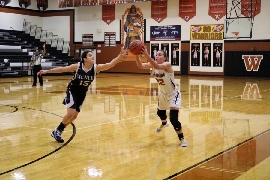 Within inches of a defender, Gabbi Wallace 22 loses her grip on the ball as she attempts to move it down the court. Wallace was a top scoring player, helping the Lady Warriors gain an early lead and run with it.
