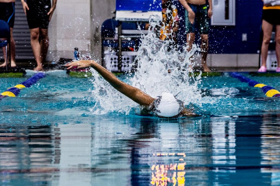 KyAnh Truong 21 hunts down the competition in a blazing fast 50.66 100-yard freestyle. This time places her first in the region and seeded sixth for the state competition.