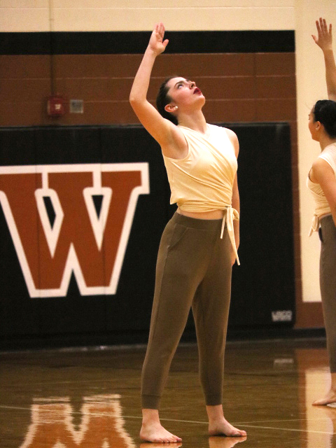 Josie Herrin 21 looks towards the ceiling during the Officer Contemporary routine. 