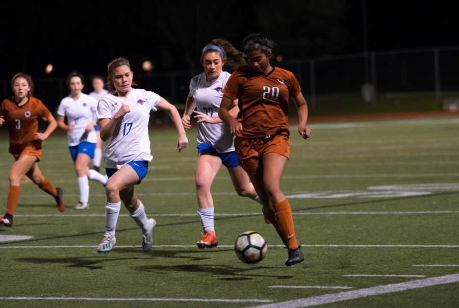 With two opposing defenders on her right side, Anisha Chintala 21 sprints with the ball downfield. Closer to the Lions goal, Chintala would make a pass cross field in attempt to set up a shot, but was unsuccessful.