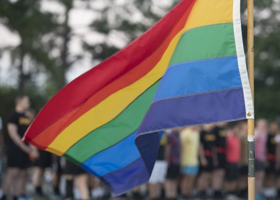 A pride flag flies during pride month at a military base in solidarity with the LGBTQ+ community. As attitudes towards them shift in a positive direction, President Trump and his administration continue to undermine their rights.