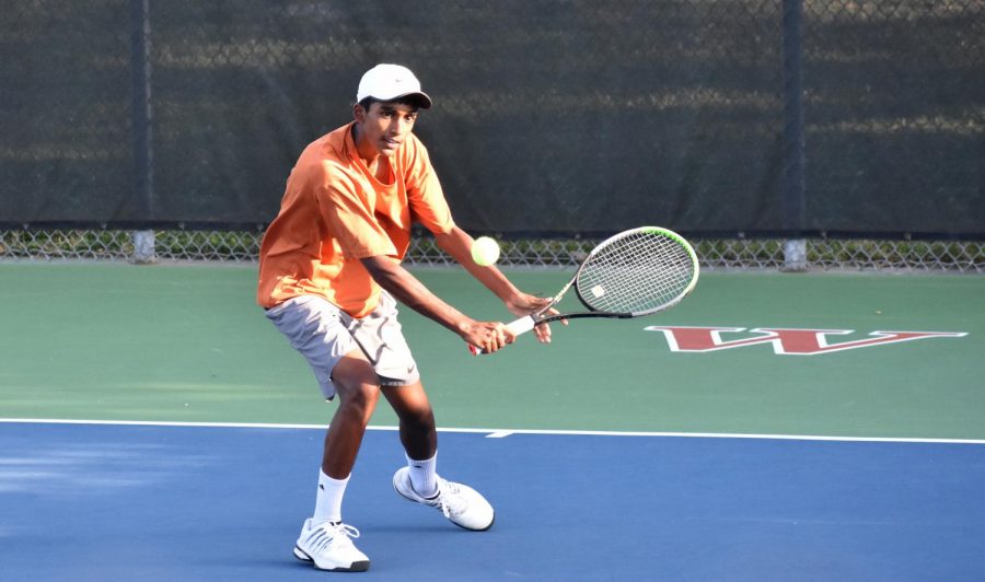 Crouching to meet the ball for a backhand drop shot, Aadhi Raja 23 looks to control the point by shifting the rhythm of the game. With his partner Marko Mesarovic 23, theyd go on to win their doubles match 6-0, 6-0. 