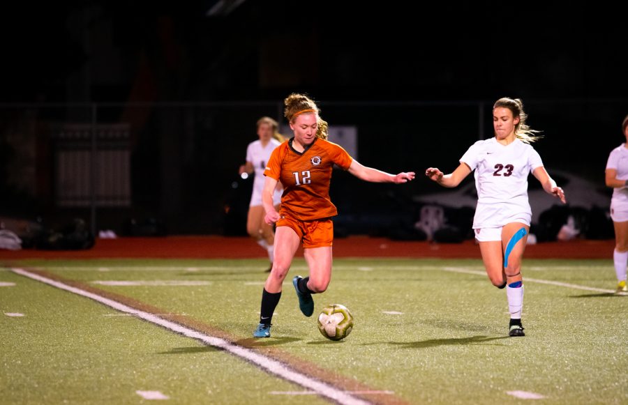Upon receiving the ball from a teammate, forward Abigial Burgett 23 dribbles the ball across the field as an opposing defender comes up from the left. The opposing defender would attempt to gain possession of the ball, but Burgett maintained possession and advanced the ball towards the Tigers goal.
