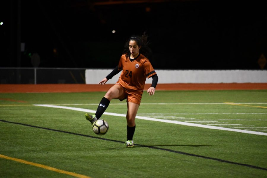 With the ball soaring towards the sideline, Issabella Garcia 21 swiftly brings it back into her control. It was knocked out of her possession right before by her defender.