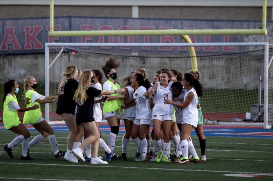 The team rejoices after the buzzer hits. The Warriors won the game 2-1 allowing them to advance to round two.