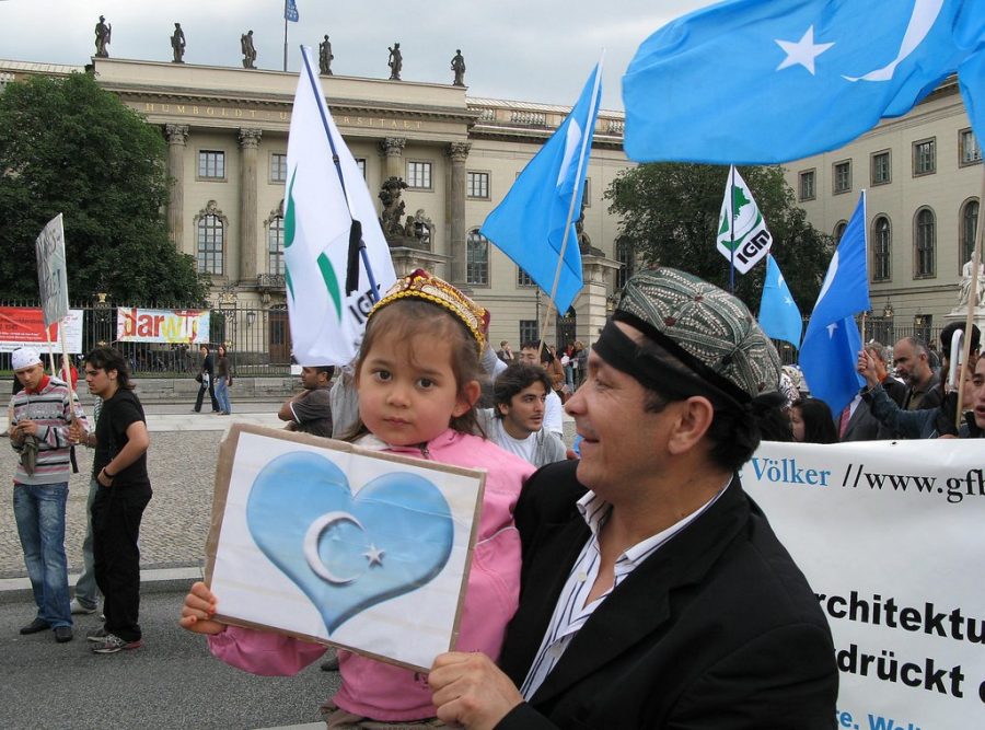 A young girl holds up a sign supporting Uighurs in China. Criticism of the Chinese government's oppression of Uighurs has been increasing internationally. Photo courtesy of langkawi.