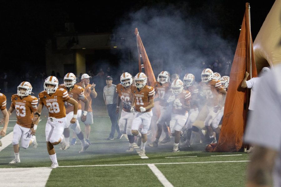 The Warriors run onto the field ready to play an amazing second half. They were eager for a win against the Stony Point Tigers.