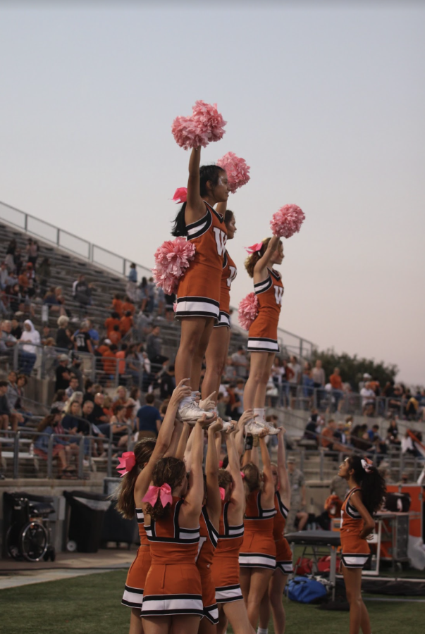 The cheerleaders cheer after the Warriors scored a two point conversion. The final score of the game was 45-2.