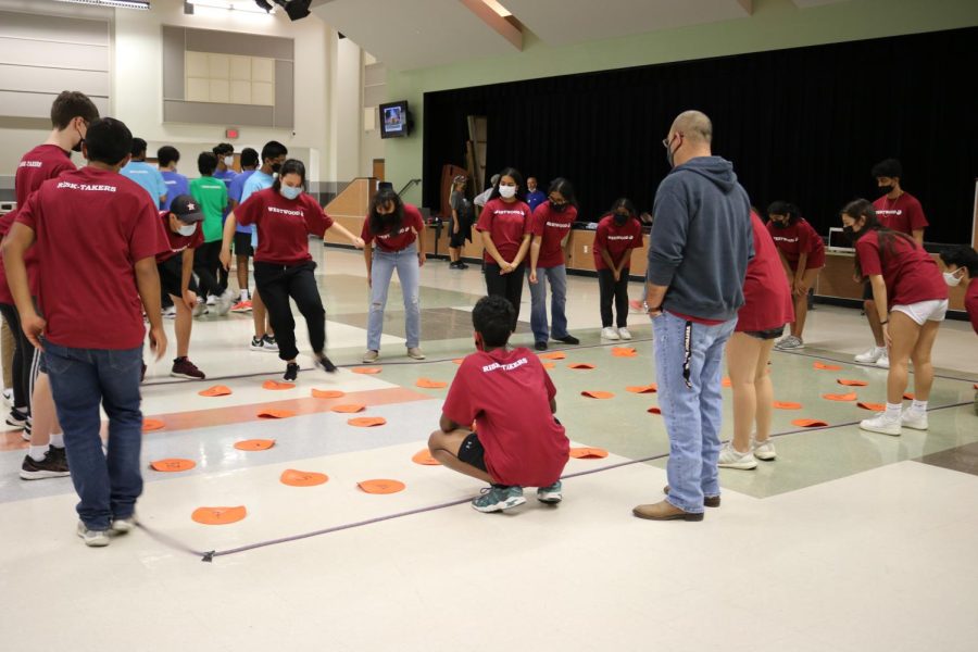 Jumping on numbers within a square, IB students participate in a team building activity in the IB Retreat within their houses. The House Risk Takers engaged in other house bonding activities like getting through a maze blindfolded and trying to separate a pair of handcuffs.