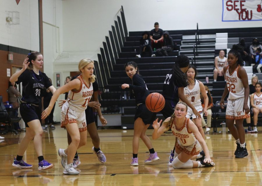 From the ground, Hailey Clementi ‘24 reaches for the ball as teammates Campbell Hardin ‘24, Grace Chao ‘23, and Mahogany Wright ‘23 stand by, ready to support. Despite their final efforts, the Warriors lost 53-23. “We all had a moment where we realized that we cant just give up, so we put in a lot more work, we started working together more,” said Clementi. 
