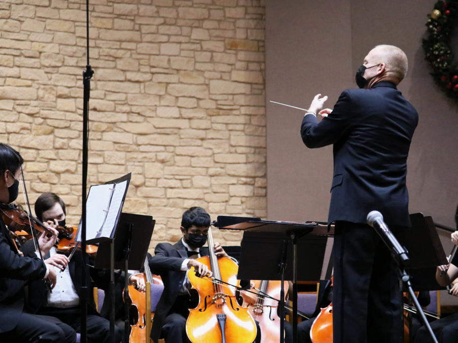 Glancing upwards, orchestra director Mr. Joshua Thompson cues the first violin section of the Concert Orchestra. Performing Furiant by Elliot Del Borgo, lush melodic lines embellished lively rhythmic passages within the low strings. 
