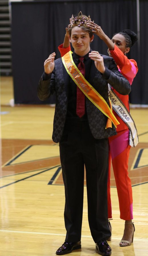Smiling, Diego Rodriguez 22 gets crowned as the winner of the Mr. Warrior Pageant. Rodriguez was  crowned by former Ms. Central Texas, Lydia Brooks, who was also a judge.