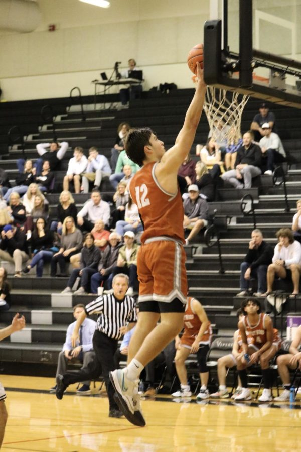 Team Captain Zach Engels 22 makes a layup on a fast break, leaving the Vipers behind.