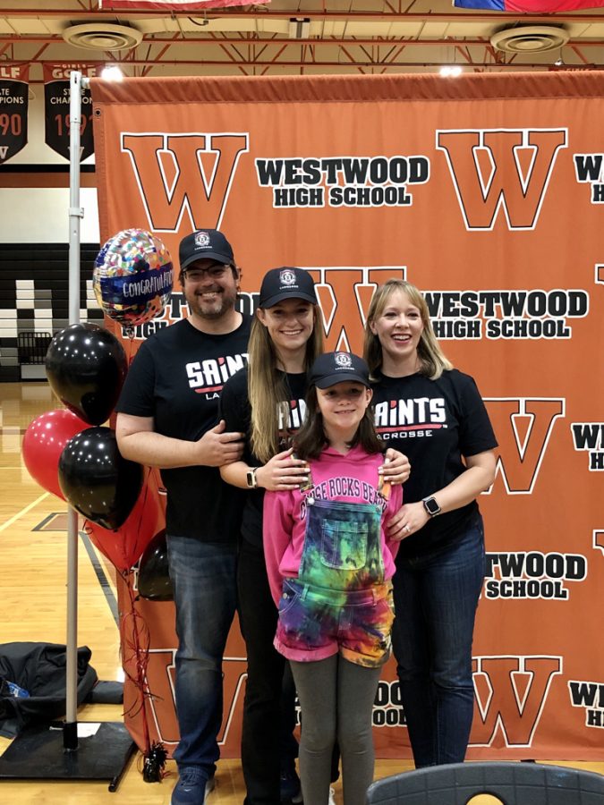 Sam Newlin 22 poses with her family after getting congratulated. Newlin is going to be playing lacrosse at DYouville College.