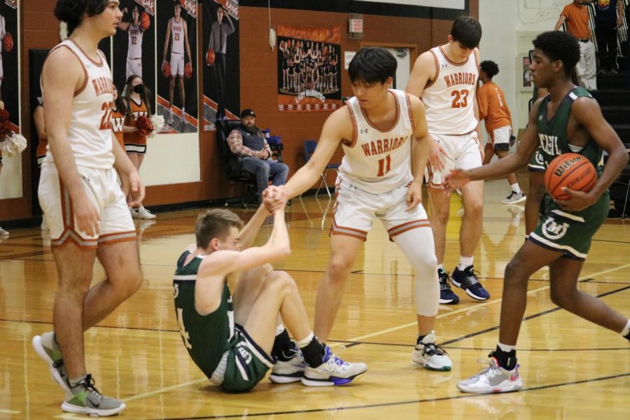 Good sportsmanship, though rare, is the specialty for our Warriors. Josh Choy 22 helped up an opponent before proceeding with the game.