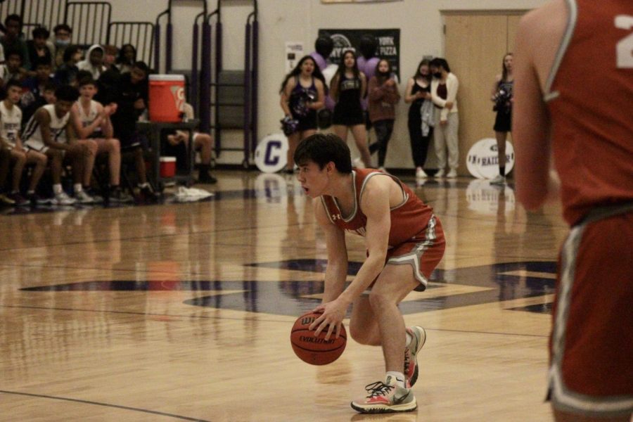 Moving down the court, Henry Chuo ‘23 looks for an opening to get to the net. “We were most focused on trying to stack as many stops as we could and creating something on offense so we could get ourselves back in the game,” Chuo said.