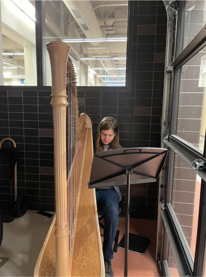 In his fifth block Orchestra class, Luc Schwalm 22 plays the harp. The harps are currently stored in the Java City location while the orchestra hall is under renovation.