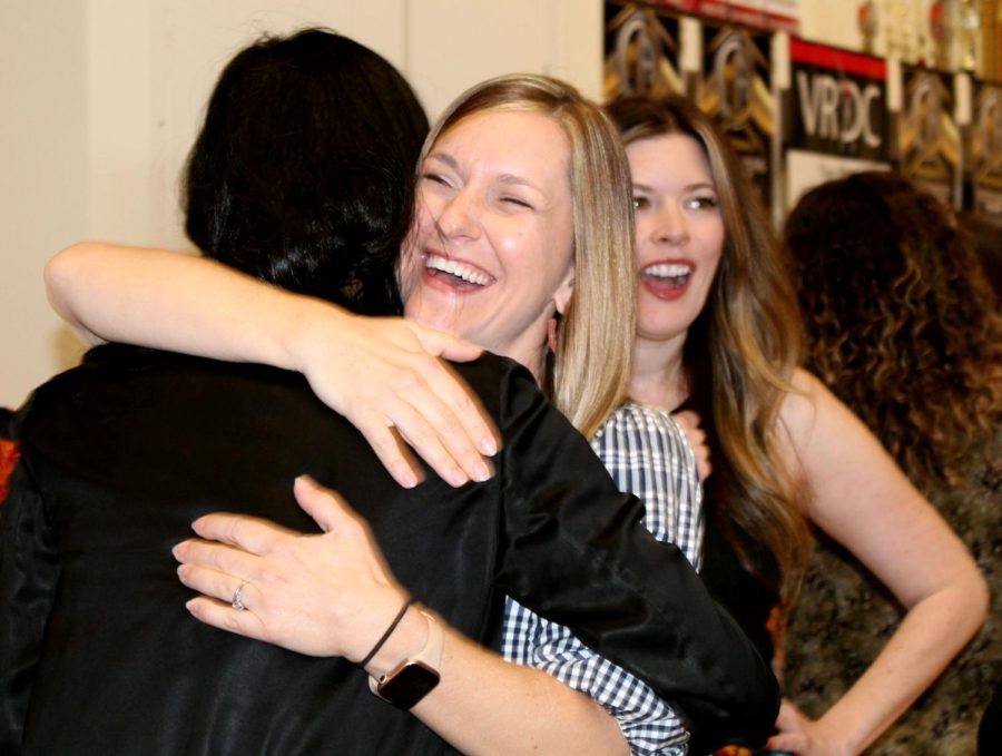 Previous SunDancer director Shelby Kelly hugs her past students. Kelly was honored at the alumni brunch for her many years of dedication to the dance department.